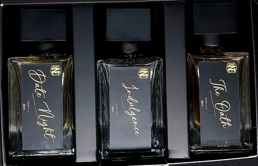 Three perfume bottles labeled Date Night, Indulgence, and The Oath in a black box.