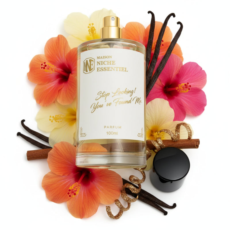 Clear glass perfume bottle labeled 'Stop Looking! You've Found Me' with a black cap.