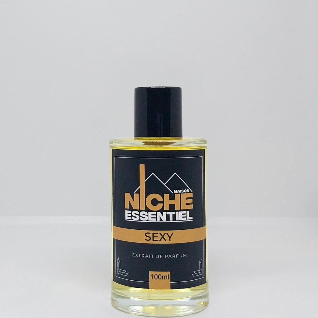 100ml bottle of Niche Essentiel Sexy perfume with a black and gold label.