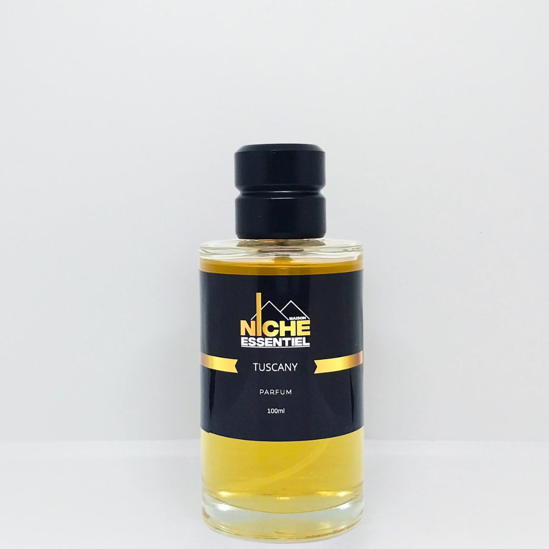 100ml bottle of Tuscany perfume with a black cap and label featuring the brand name Niche Essentiel.