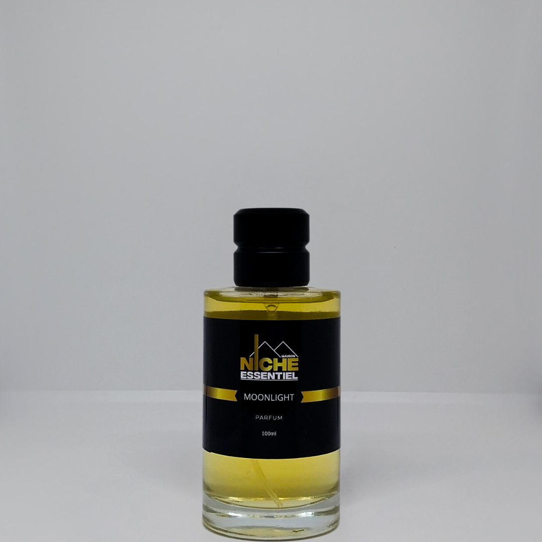 Glass bottle of Moonlight perfume with a black label and gold accents, containing 100ml of fragrance.