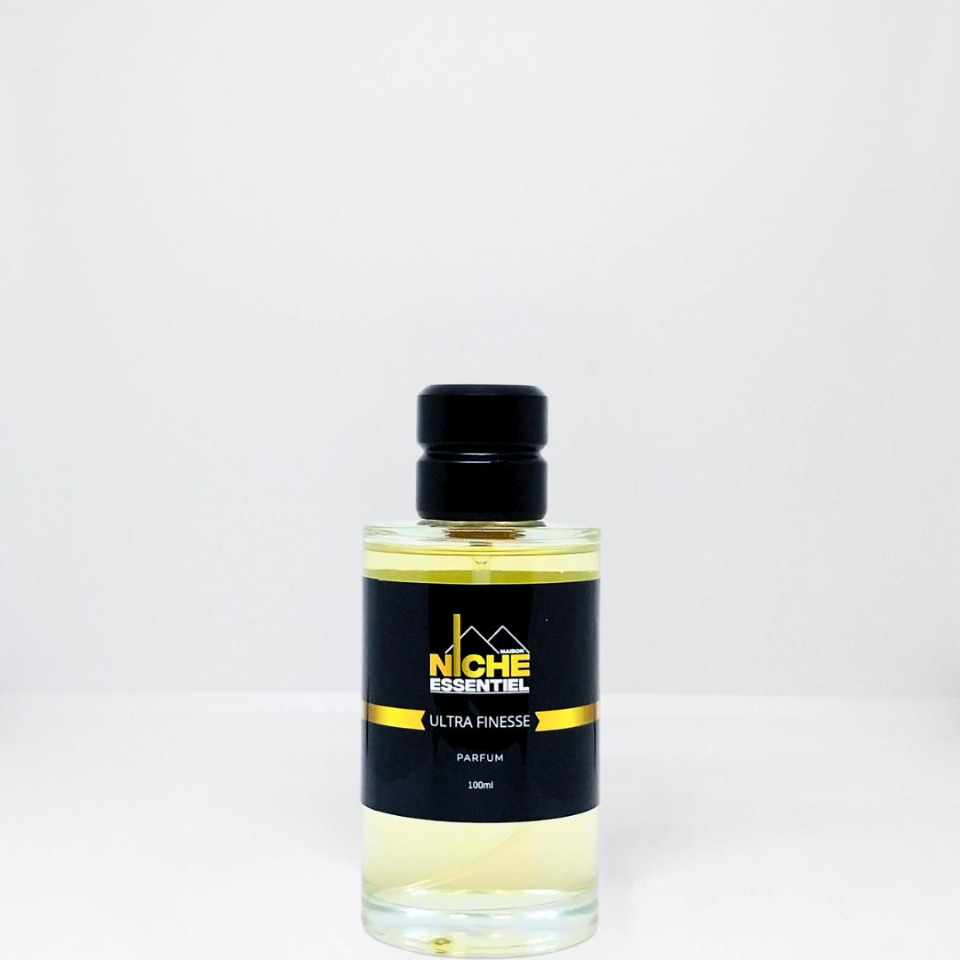 Clear glass bottle of Ultra Finesse perfume with a black label and black cap.