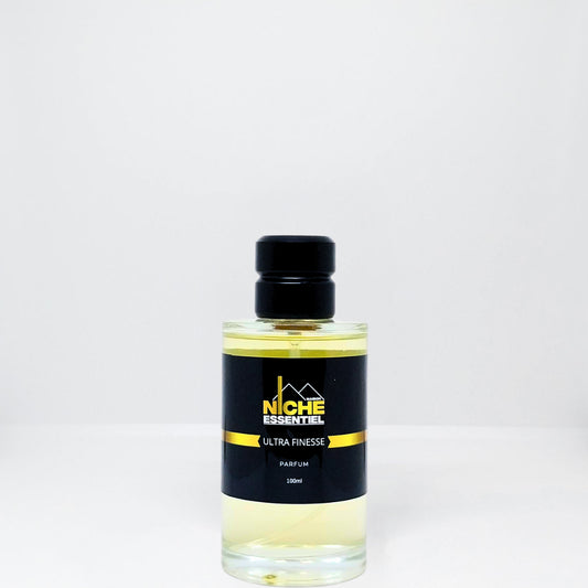 Clear glass bottle of Ultra Finesse perfume with a black label and black cap.