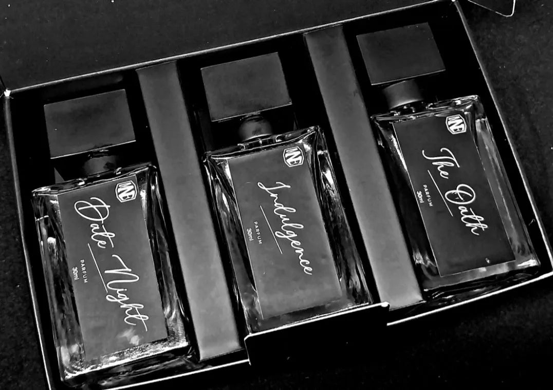 Three fragrance bottles labeled 'Date Night', 'Indulgence', and 'The Date' in a black box.